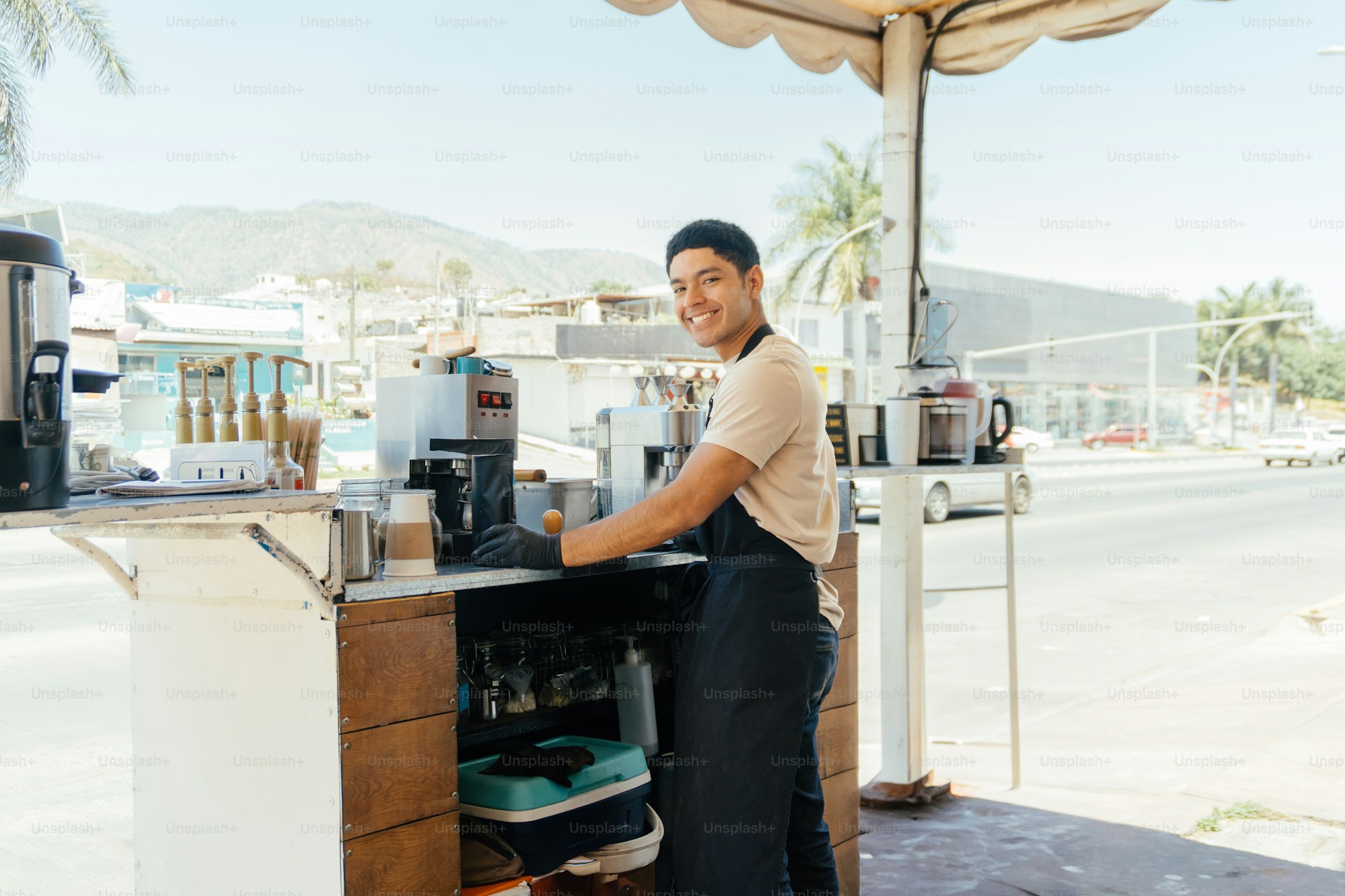 Barista preparing cold brew at a mobile coffee cart